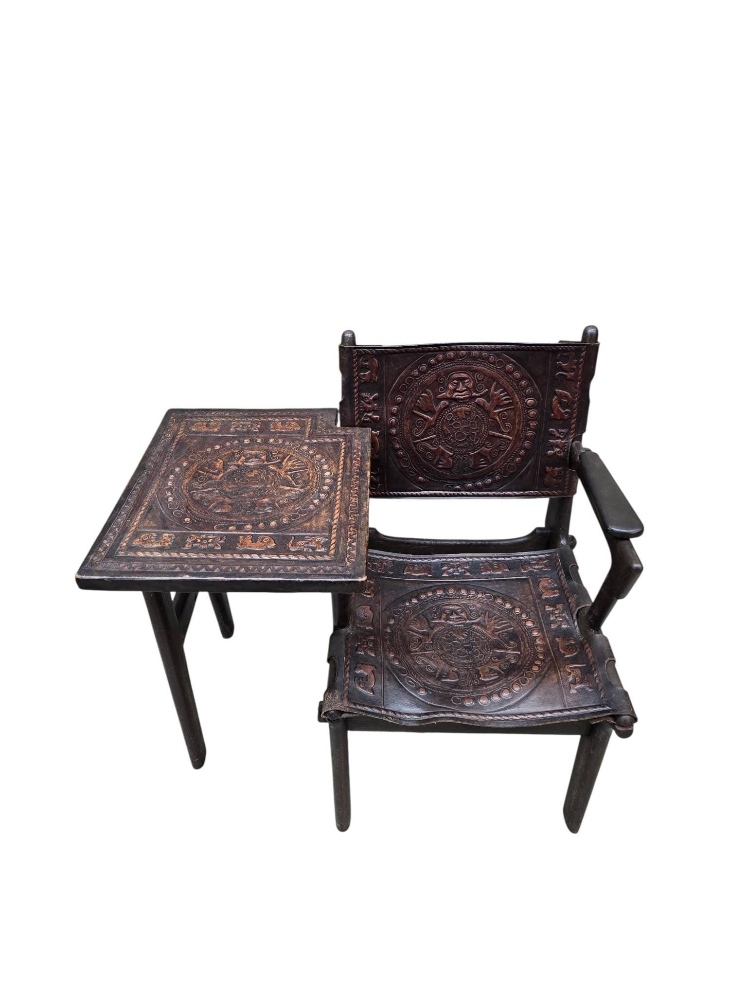 Vintage Rustic Tooled Leather Primitive Gossip Chair by Angel Pazmino: Vintage Tooled Leather Primitive Wood Base Gossip Chair by Angel PazminoThis rare and unique vintage carved walnut and hand tooled leather sling chair is attached to a tooled leather top side table