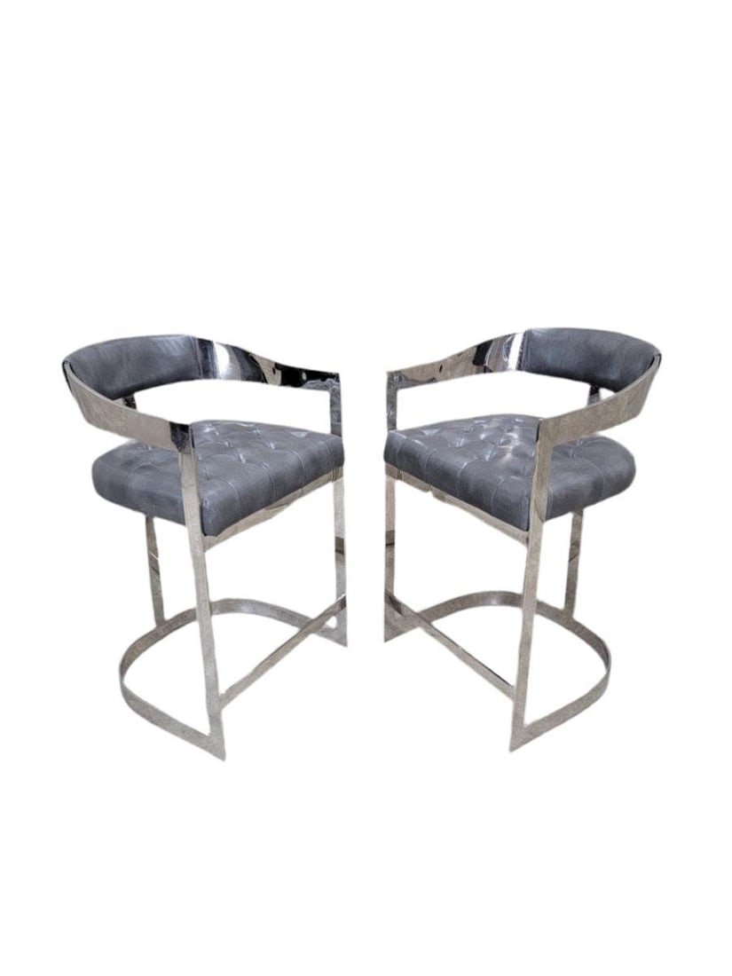 Vintage Modern Bar Stools - Pair: Vintage Modern Chrome Flat Bar Curved Back Tufted Bar Stools in Steel Grey Italian Leather - Pair The sleek chrome flat bar base provides a contemporary touch, while the curved back and tufted design