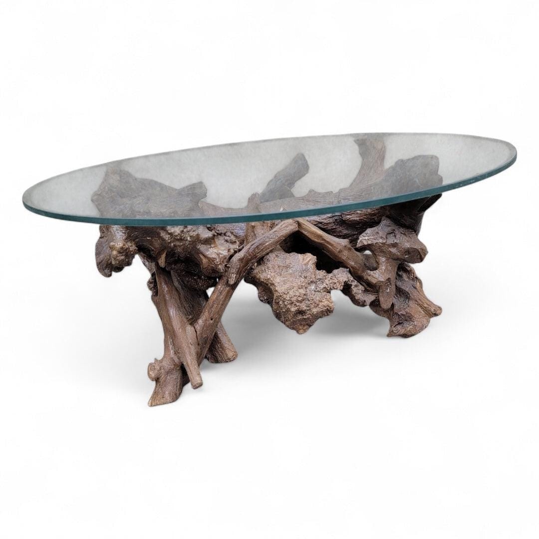 MCM Drift/Teak Root Coffee Table: Mid Century Drift/Teak Root Live Edge Low Round Glass Top Cocktail Table The Table is a stunning blend of natural beauty and modern design. Featuring a unique live edge crafted from rich teak root,