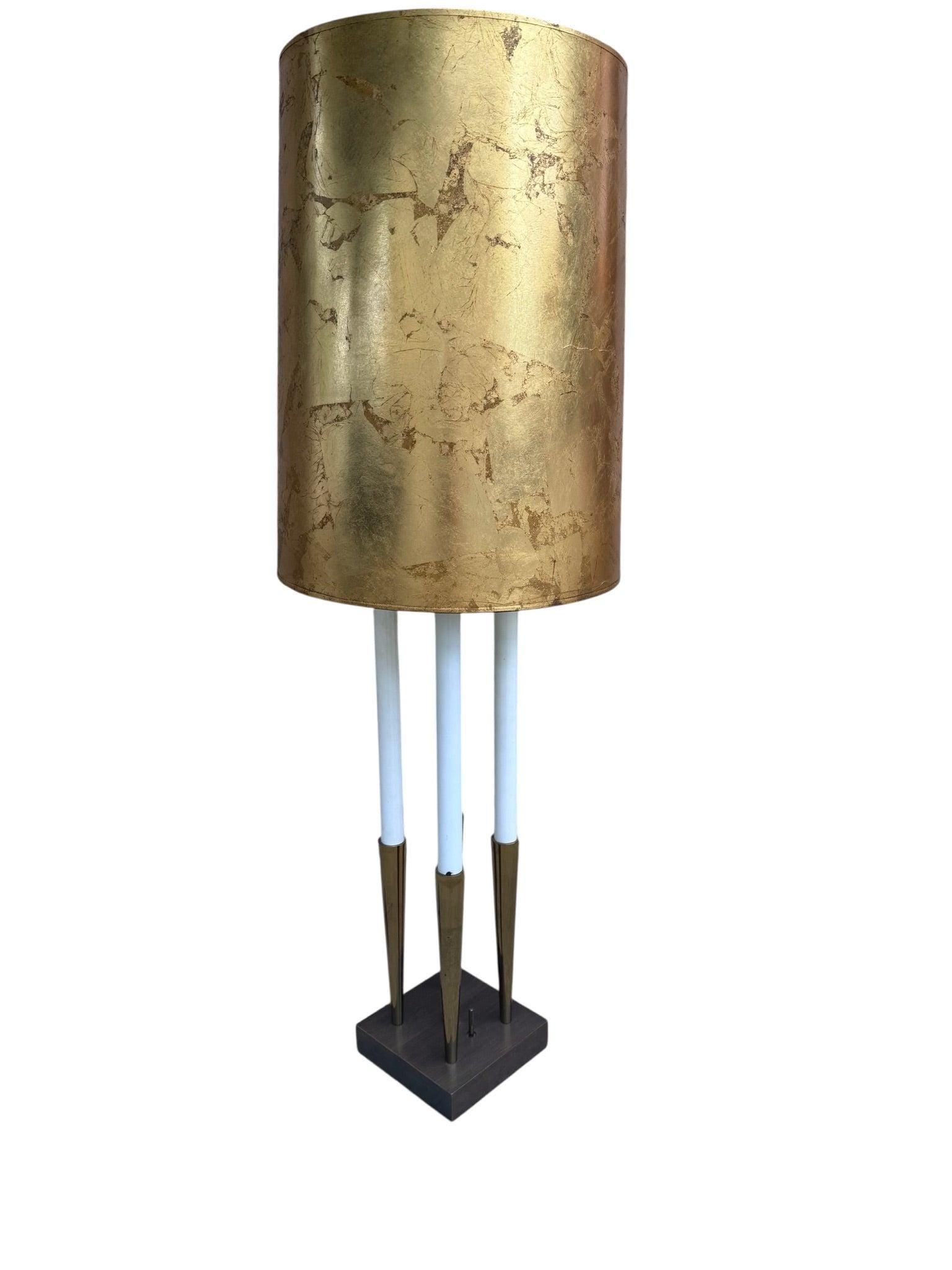 MCM Stiffle Candelabra Lamp by Tommi Parzinger: Materials: metal, plasticMid Century Modern Brass Stiffle Candelabra Lamp by Tommi ParzingerThis striking MCM candelabra lamp is a sophisticated example of Tommi Parzinger’s timeless design for