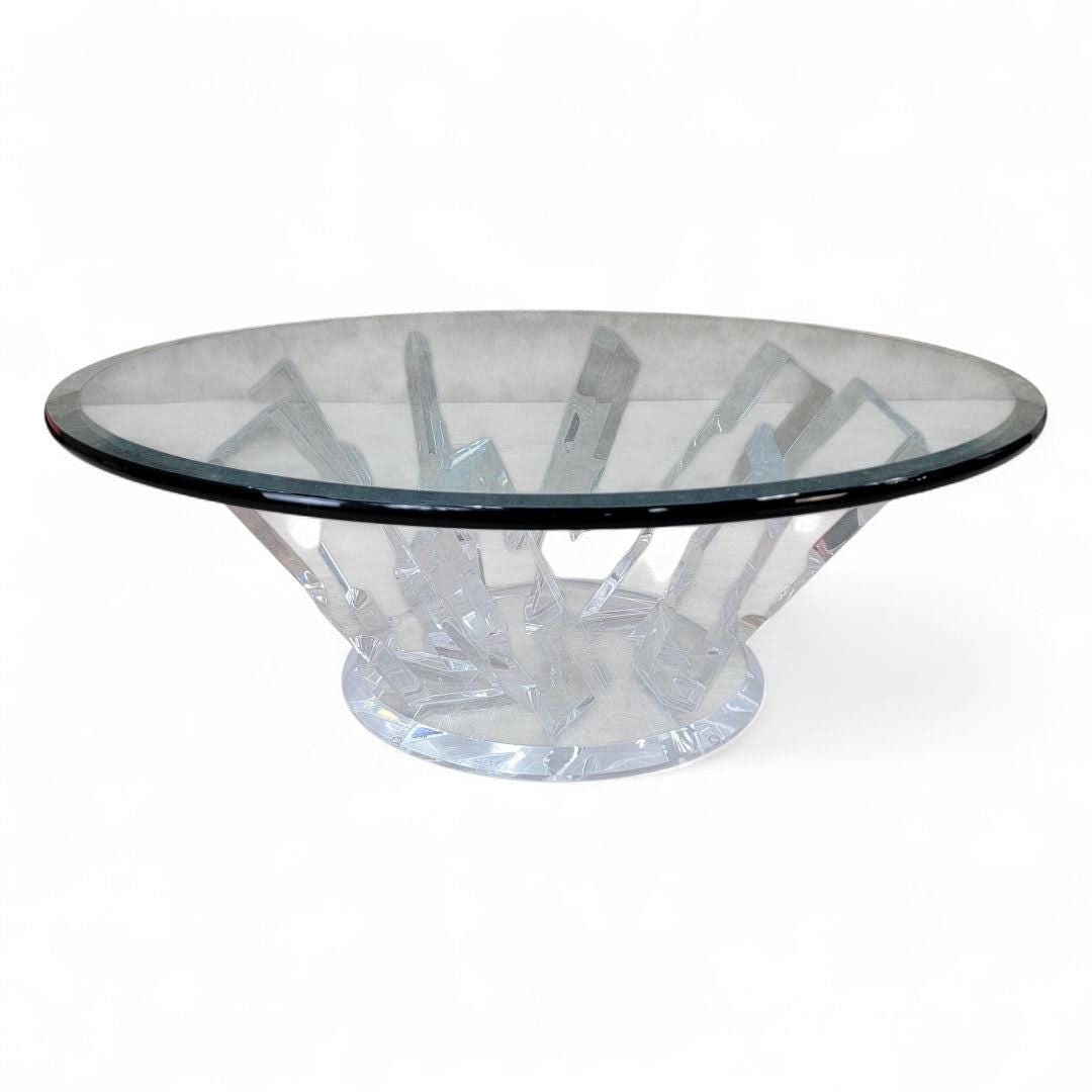 Postmodern Ice Crystal Lucite Coffee Table: Materials: glass, lucite, plasticPostmodern Ice Crystal Lucite Base with Round Beveled Glass Top Coffee TableThis piece combines contemporary design with functionality, showcasing a unique lucite