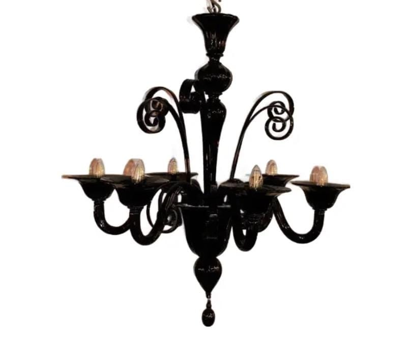 Italian Murano Glass Chandelier in Black: Materials: Glass Vintage Italian Murano Glass Chandelier in BlackDecorate your space with this monochrome black glass ornate chandelier. Six lights branch off from the base while four spirals rise up 