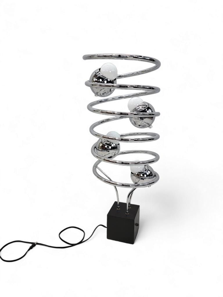 MCM Atomic Space Age Chrome Abstract Table Floor Lamp: Mid Century Modern Atomic Space Age Chrome Abstract Table Floor LampThis table/floor lamp has a swirling chrome design supporting 4 chrome sphere lights. Each light has 3 setting options. The piece re