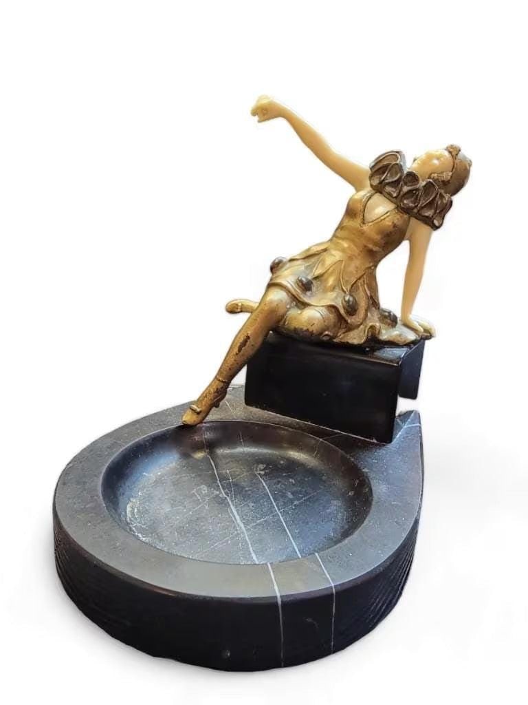 Antique French Art Deco Harlequin Posing Marble Ashtray: Antique French Art Deco Chryselephantine Bronze Harlequin Posing Marble Ashtray This exquisite French Art Deco ashtray is a testament to the opulence and craftsmanship of the early 20th century. Craft