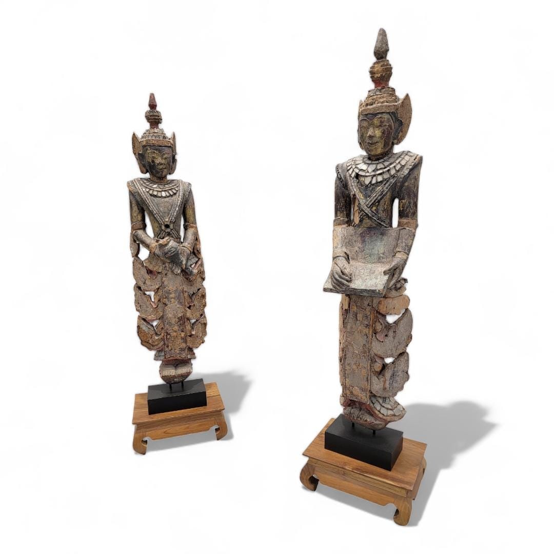 Antique Burmese Carved Inlaid Glass Monastic Sculptures - Set of 2: Materials: woodAntique Burmese Carved and Lacquered Wood with Inlaid Colored Glass Monastic Sculptures - Set of 2 Enhance your home decor with this exquisite set of antique Burmese carved and