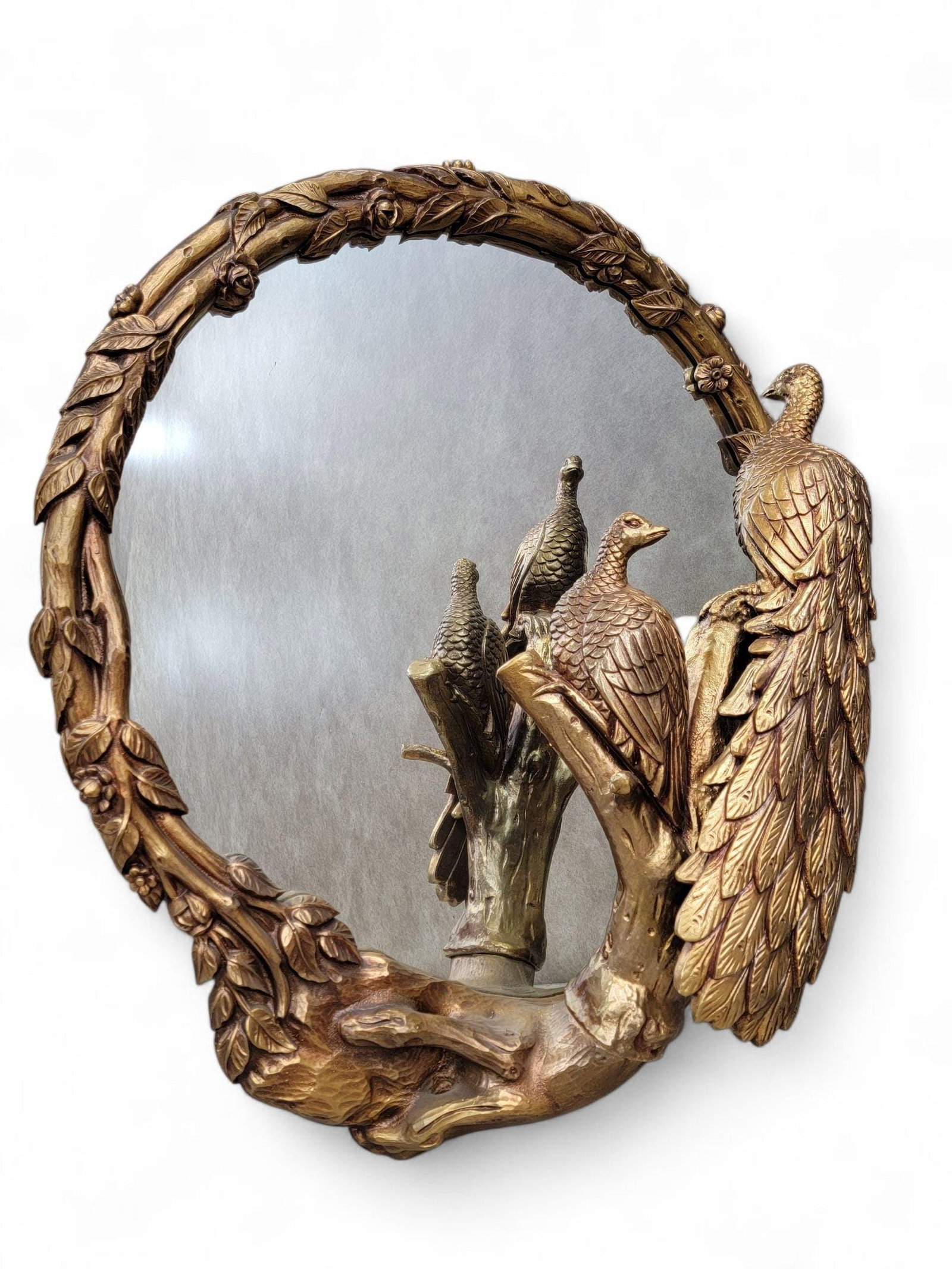 Hollywood Regency Italian Peacock Wall Mirror: Materials: glass, plasterItalian Hollywood Regency Gilded Peacock Wall MirrorThis stunning Hollywood Regency peacock mirror imported from Italy dating back to the 1960s. Affluent, sculptural and