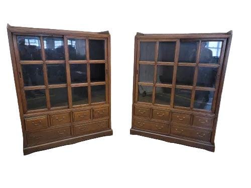 Vintage Chinese Sliding Door Elm Display Cabinet - Pair: Vintage Chinese Elm Display Cabinets - PaidPair of vintage Chinese elm display cabinets featuring a warm brown lacquer finish. Each cabinet offers sliding glass doors, six drawers for ample storage,