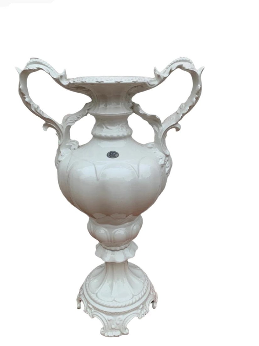 Vintage Italian Azzolin Brothers White Capodimonte Vase: Vintage Italian Azzolin Brothers White Capodimonte Vase with HandlesDecorate your side table with this monochrome white ceramic vase. The vase is ornately constructed with large flourishing handles an