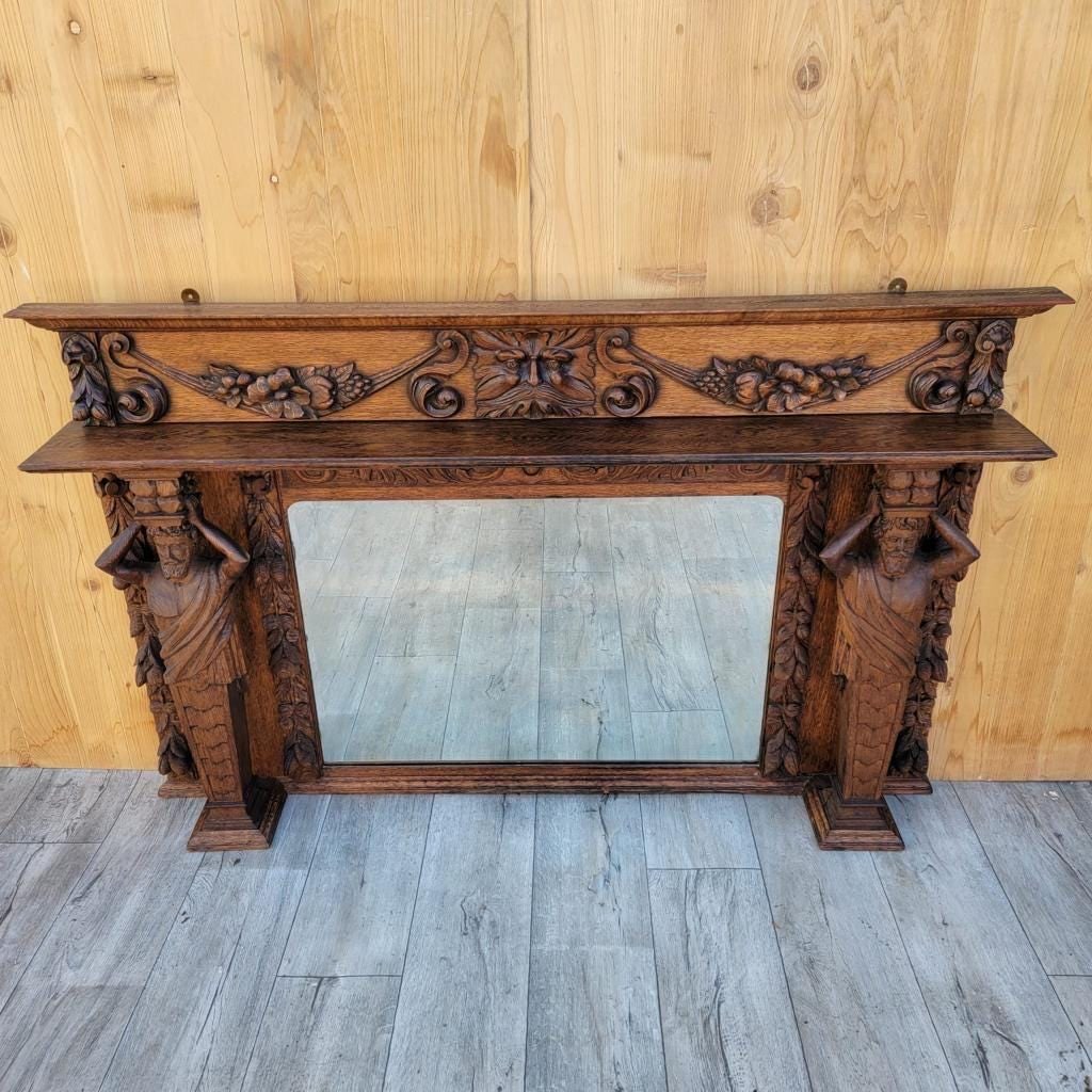 Antique Neoclassical Carved Figural Quarter-Sawn Fireplace Mantel Mirror Topper: Materials: Wood.Antique Neoclassical Hand Carved Figural and Foliate Quarter-Sawn Fireplace Mantel Beveled Mirror TopperStunning 19th Century Neoclassical Hand Carved Finely Detailed Figural and