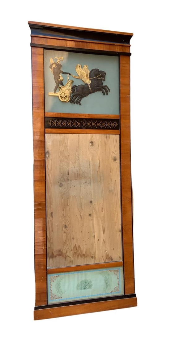 Antique German Biedermeier Style Trumeau Wall Mirror: Antique German Biedermeier Style Trumeau Wall MirrorSouthwest German Biedermeier style wall mirror.Mirror - walnut veneer, ebonized profile strip at the top, in the medallion relief: Cupid on a
