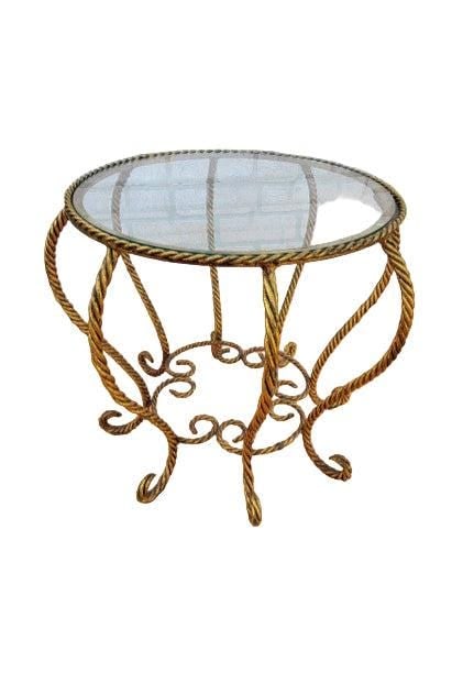 Hollywood Regency Italian Gold Gilt Rope Spider Table: .Hollywood Regency Italian Gold Gilt Rope Glass Top Spider TableThis small sculptural table features a round glass top and a gold gilt iron rope base. The base forms a "Spider" leg base with scrolling