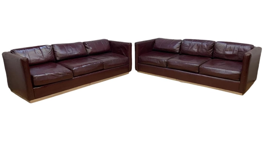 MCM Ward Bennett Style Sofas for Upholstery - Set of 2: Mid Century Modern Ward Bennett Style Sofas on Chrome Plinth Bases in Original Burgundy Leather for Upholstery - Set of 2The sofas are in original condition and we highly recommend custom upholstery.