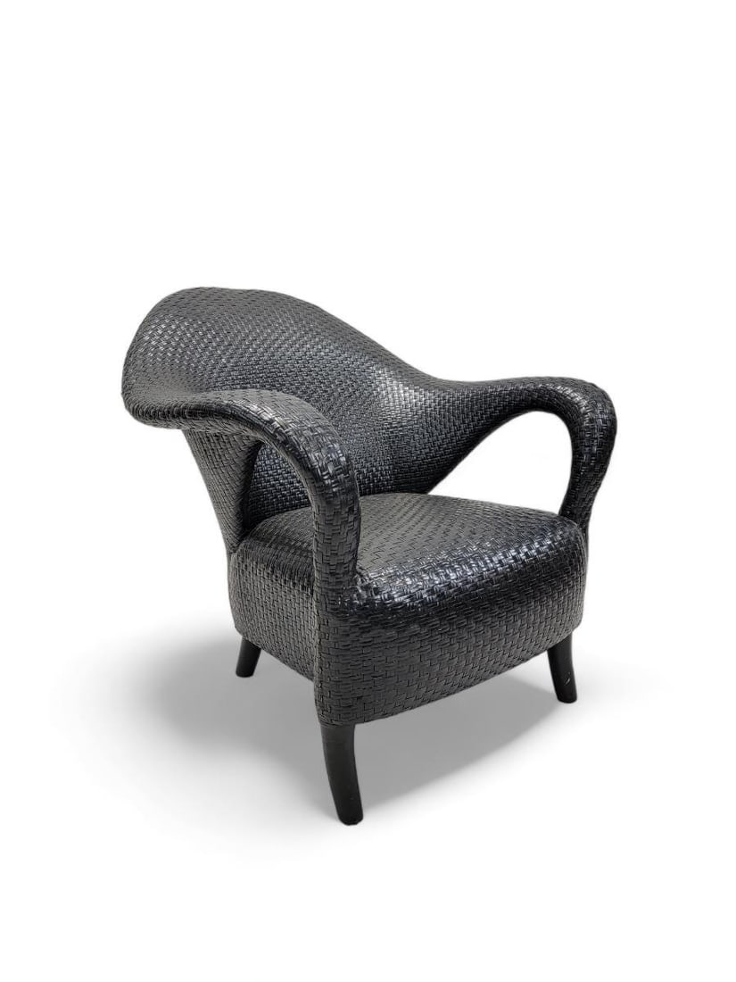 Vintage Italian Sculptural Woven Leather Rattan Style Lounge Chair: Vintage Italian Sculptural Woven Leather Rattan Style Lounge ChairThis sculptural vintage armchair was woven from leather strips. Its dark neutral coloring makes it perfect for a variety of spaces.