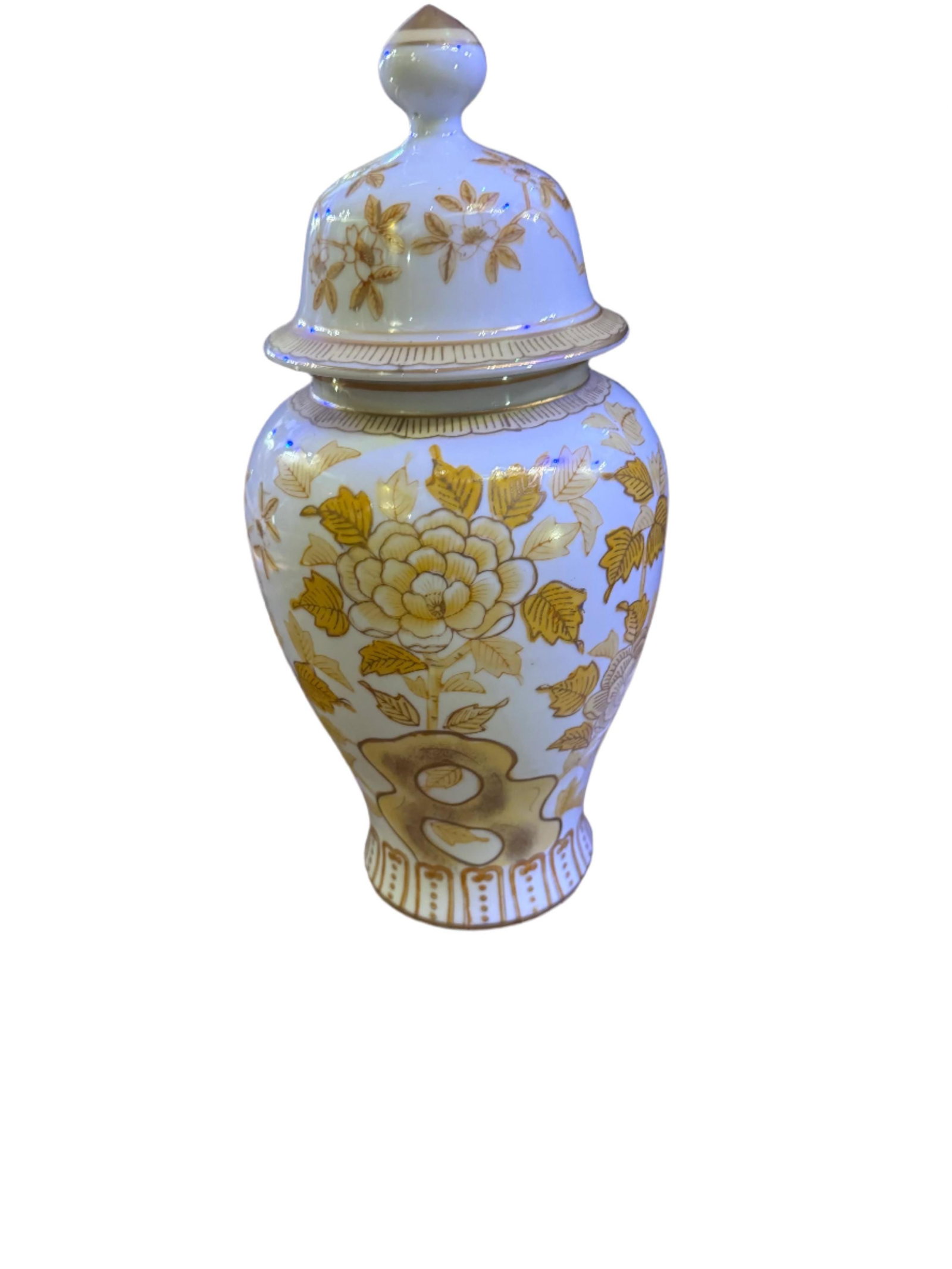 Vintage Andrea by Sadek Porcelain Japanese Lidded Chinoiserie Ginger Jar Vase: Vintage Andrea by Sadek Porcelain Japanese Gold/Yellow Lidded Chinoiserie Ginger Jar VasePerfect for enhancing your home decor or as a gift, this vase/urn is a timeless addition that will elevate any 