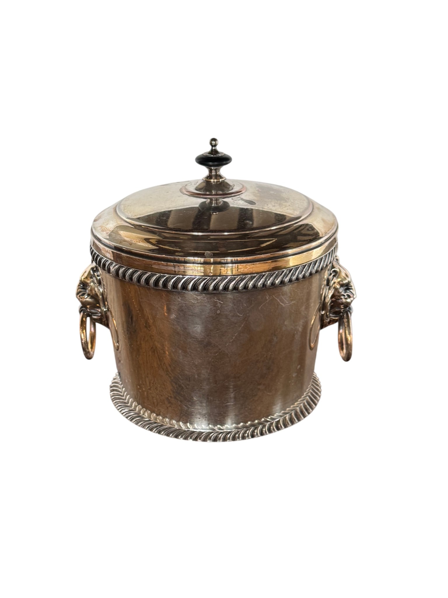 Sterling Silver Ice Bucket with Lion Head Handles, Mid-20th Century: This elegant mid-20th century sterling silver ice bucket features decorative rope-twist banding along the top and bottom rims. The bucket is adorned with impressive lion head handles, each grasping a
