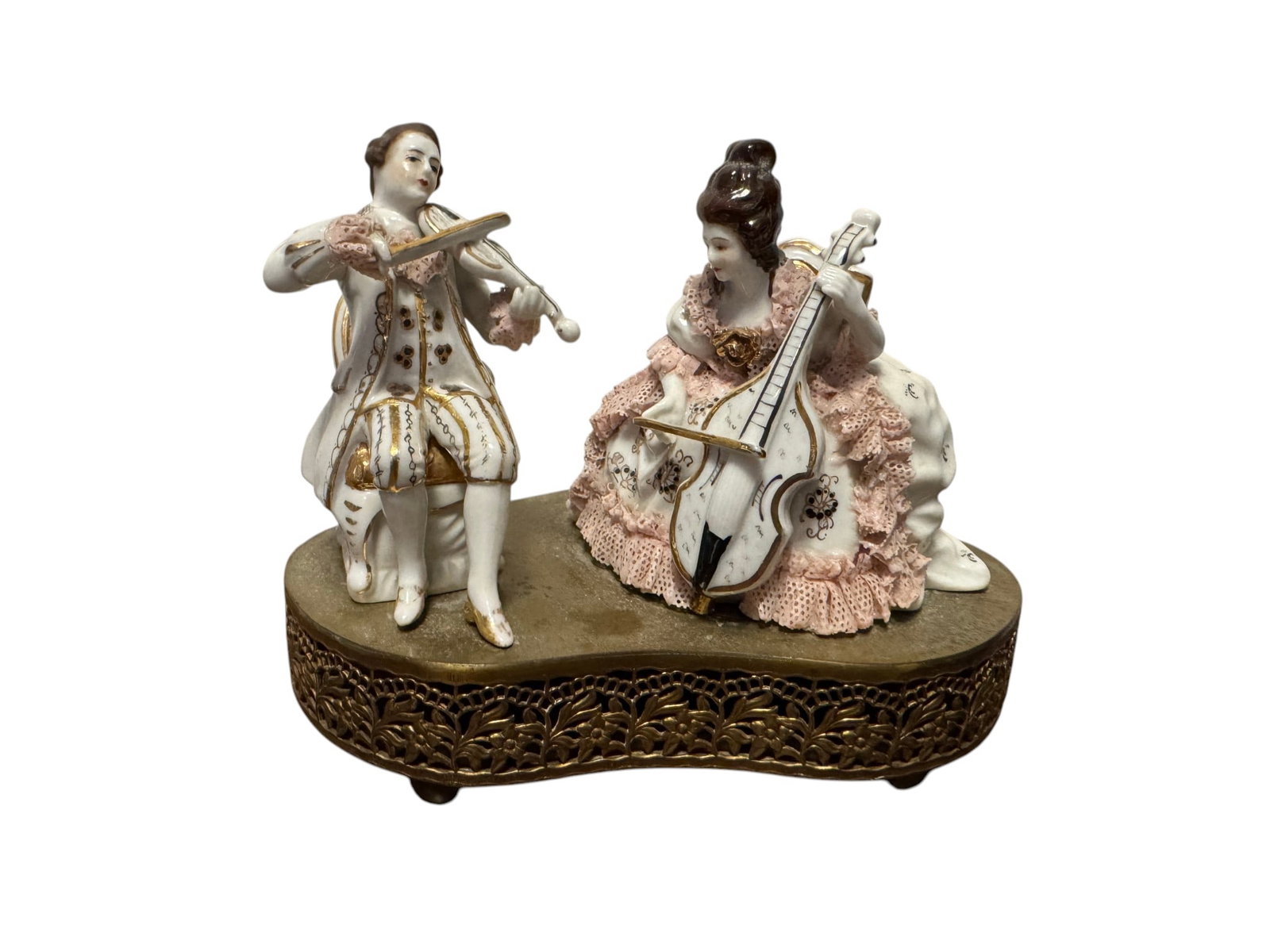 Porcelain Musical Figurine of 18th Century Musicians: This charming porcelain figurine depicts two 18th-century musicians, a gentleman playing a violin and a lady playing a mandolin, seated on ornate chairs atop a decorative ormolu-style base. The