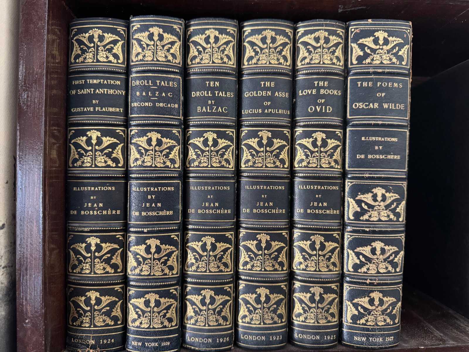 Jean de BosschÃ¨re Illustrated Works: Five Volumes, Boni & Liveright, 1923-1927: A collection of five elegantly bound volumes, each exquisitely illustrated by Jean de BosschÃ¨re. This grouping includes: Gustave Flaubert's "First Temptation of St. Anthony" (London,