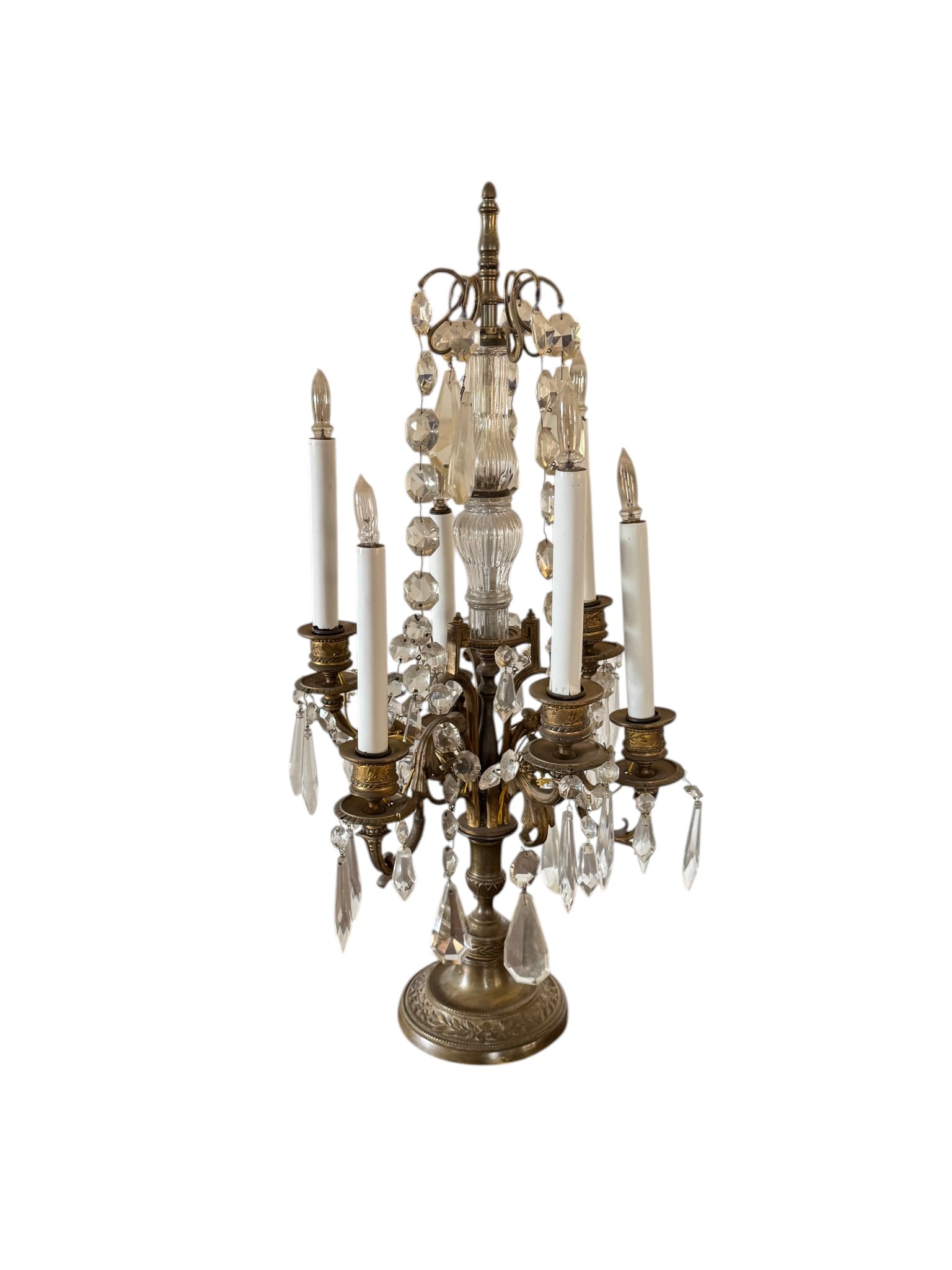 Gilt Bronze and Crystal Five-Light Candelabra: An ornate five-light candelabra, likely French from the late 19th or early 20th century, crafted from gilt bronze and adorned with numerous crystal prisms. The piece features a central stem and four