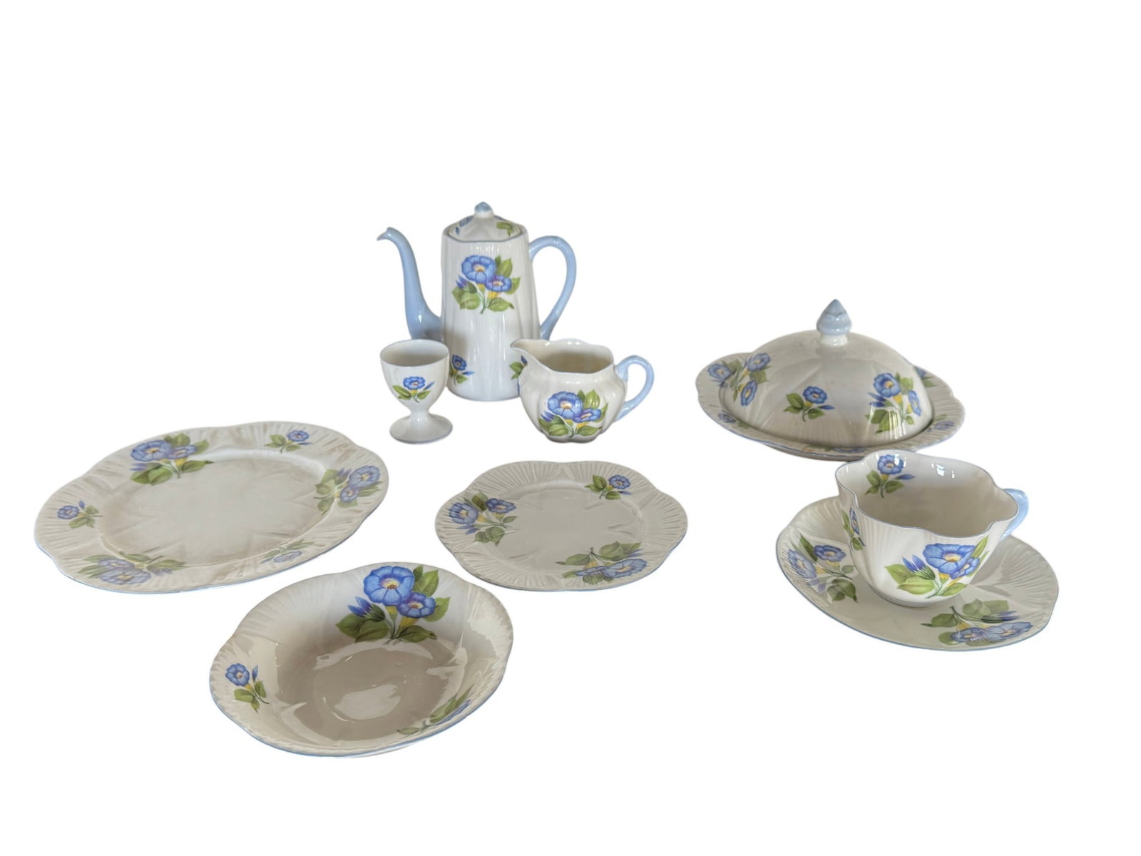 Shelley Fine Bone China "Morning Glory" Partial Breakfast Set: A charming partial breakfast set by Shelley, crafted from fine bone china in England. The set features the "Morning Glory" pattern, characterized by delicate blue and green floral motifs. Consisting