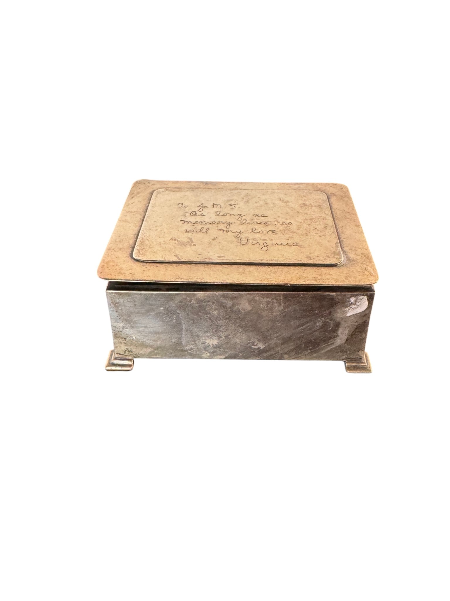 Sterling Silver Engraved Trinket Box: A charming sterling silver trinket box, possibly American, early 20th century. The rectangular box features a slightly domed lid with a central rectangular panel, beautifully engraved with a personal 