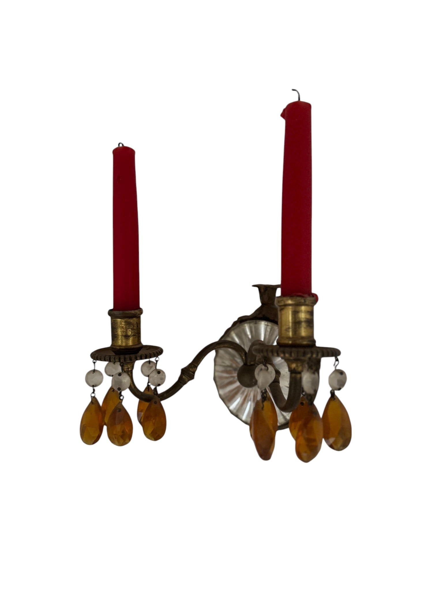 Pair of Vintage Brass and Crystal Sconces: A pair of vintage wall sconces, likely from the Mid-20th Century, crafted from brass with intricate detailing. Each sconce features two candle holders and is adorned with amber-colored faceted