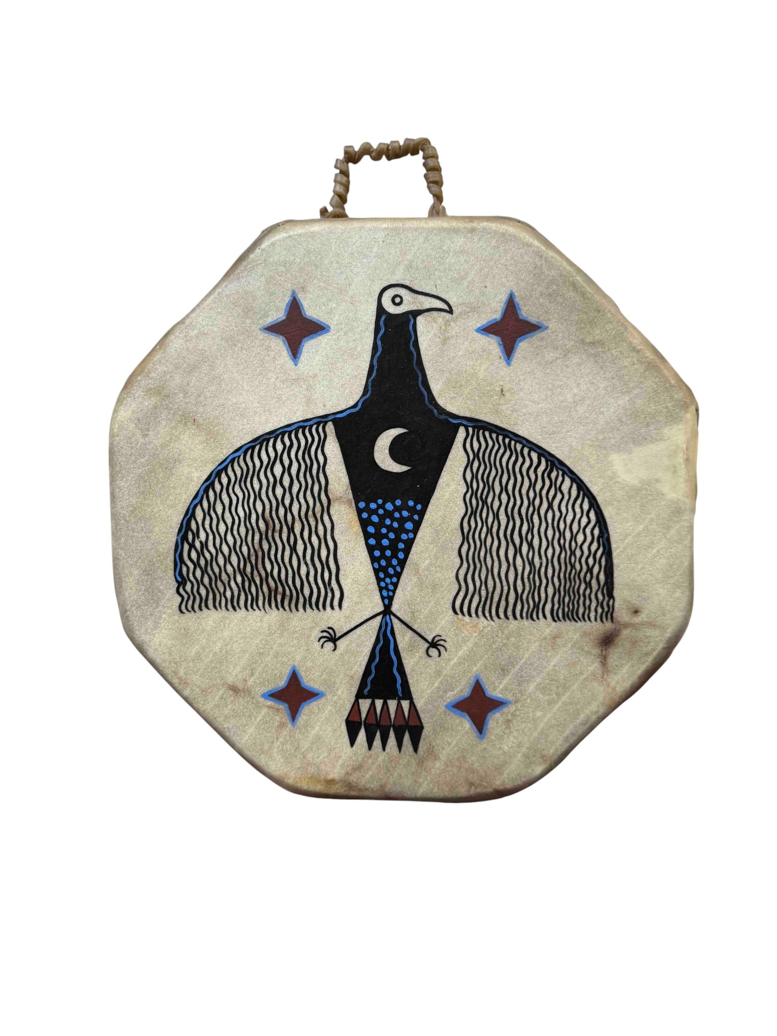 Native American Style Octagonal Hand Drum with Bird Motif: This octagonal hand drum features a striking hand-painted bird motif in black, blue, and brown tones against a natural rawhide surface. The geometric bird design, possibly depicting a thunderbird or