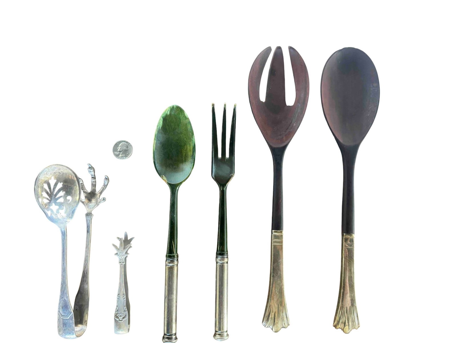 Collection of Vintage Sterling Silver and Horn Flatware, Early 20th Century: A charming collection of vintage flatware, likely dating to the early 20th century. This lot includes five distinct pieces: a pierced silver serving spoon with an ornate handle, a small silver tong