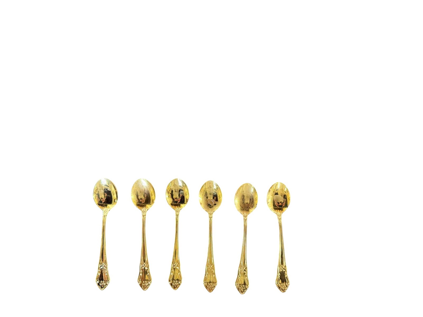 Set of Six 24K Gold Plated Demitasse Spoons, JANI'S COLLECTION, Made in Sweden: This elegant set features six demitasse spoons, crafted from 24K gold-plated metal. Each spoon showcases a classic design with ornate detailing on the handle, characteristic of traditional European