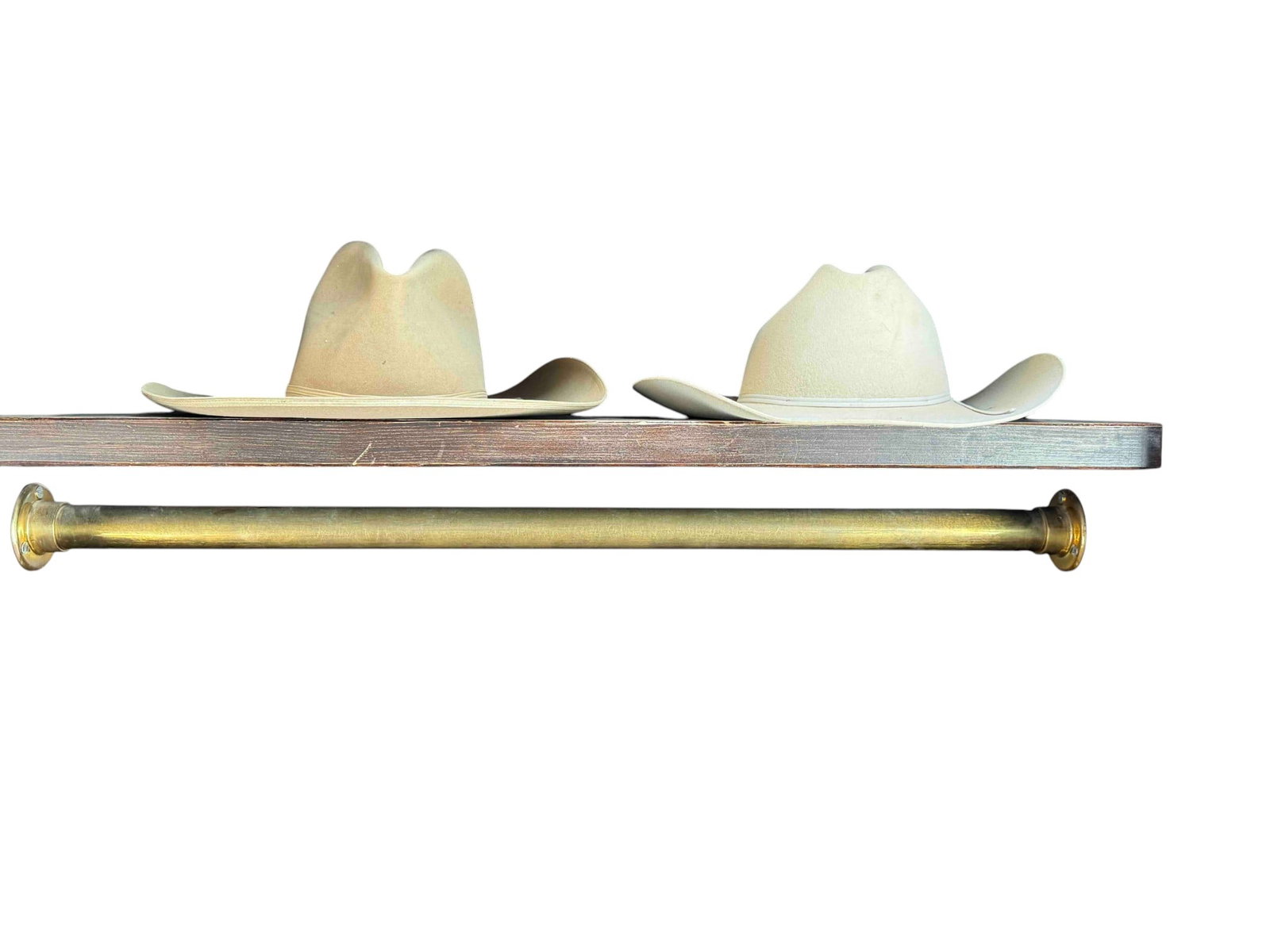 Pair of Vintage Felt Western Hats by Stetson and Stallion: This lot features two vintage felt western hats: one by Stetson, known for its high-quality craftsmanship, and one by Stallion by Emerson. The Stetson hat is a classic light beige felt with a rich