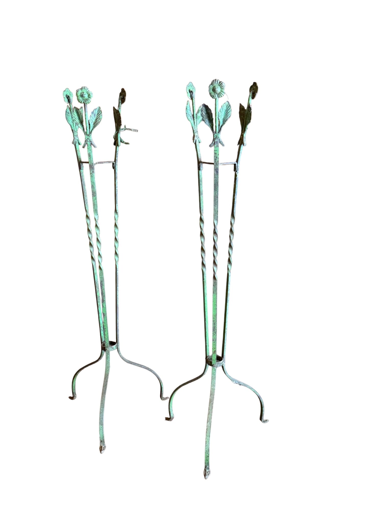 Pair of Green Wrought Iron Plant Stands with Floral Motif: A pair of wrought iron plant stands, likely from the early to mid-20th century, in a vibrant green. The design incorporates twisted square stock iron for the vertical supports, culminating in