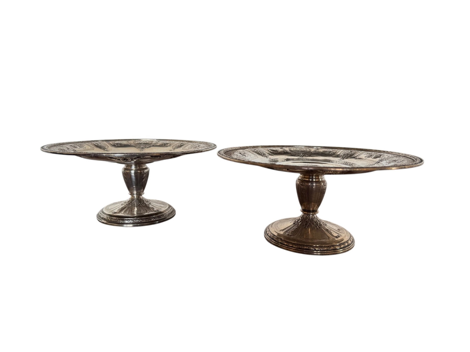 Pair of Gorham Sterling Silver Reticulated Comports, circa 1890s: This lot features a distinguished pair of Gorham sterling silver reticulated comports, epitomizing late 19th-century American silver craftsmanship. Each comport is meticulously crafted with a circular