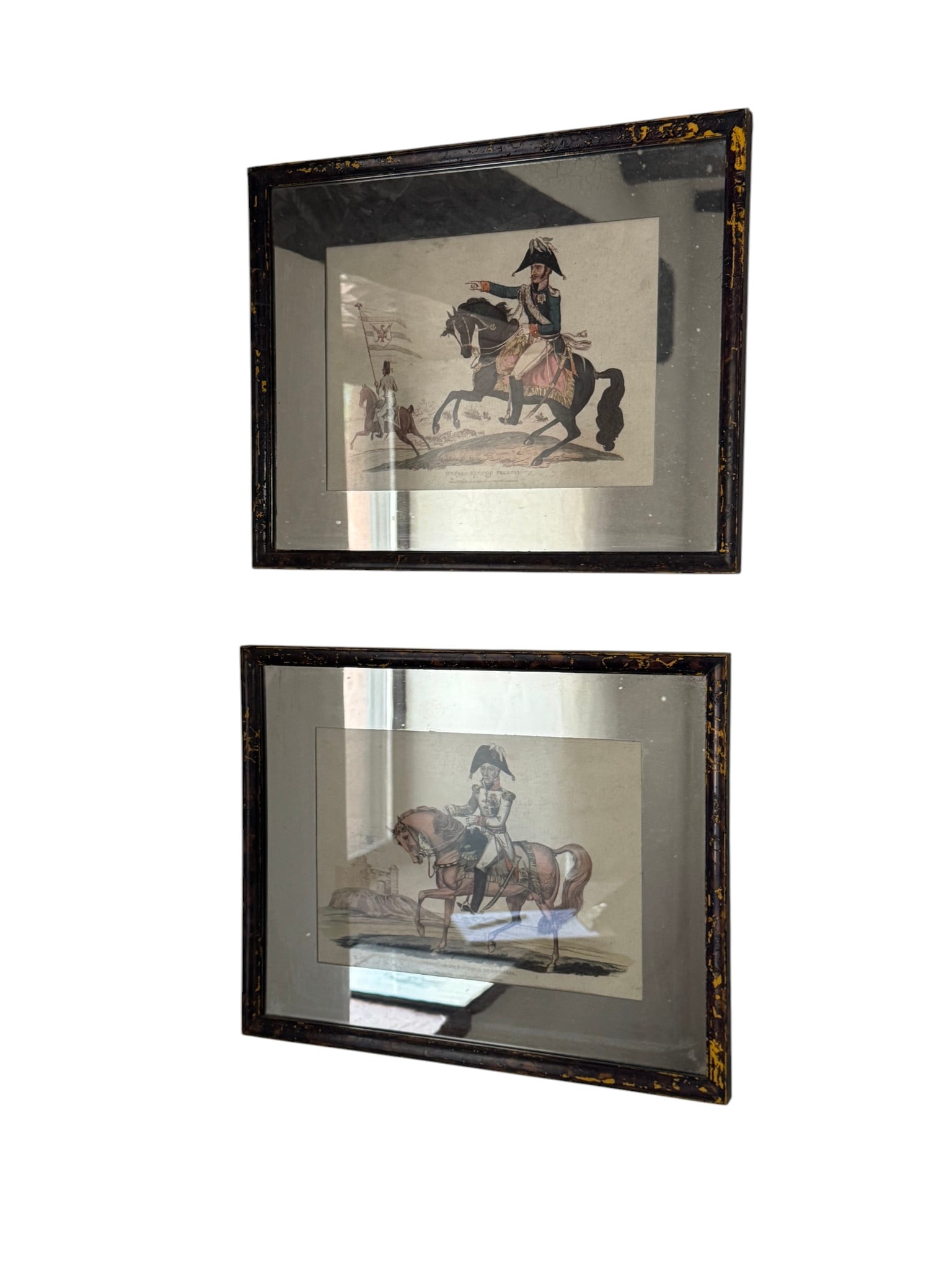 Pair of 19th Century Hand-Colored Engravings: "WINFRED KING OF PRUSSIA" and "FRANCIS 2ND EMPEROR OF: A striking pair of 19th-century hand-colored engravings, featuring equestrian portraits of "WINFRED KING OF PRUSSIA" and "FRANCIS 2ND EMPEROR OF AUSTRIA." Each print is housed within a black and gold 