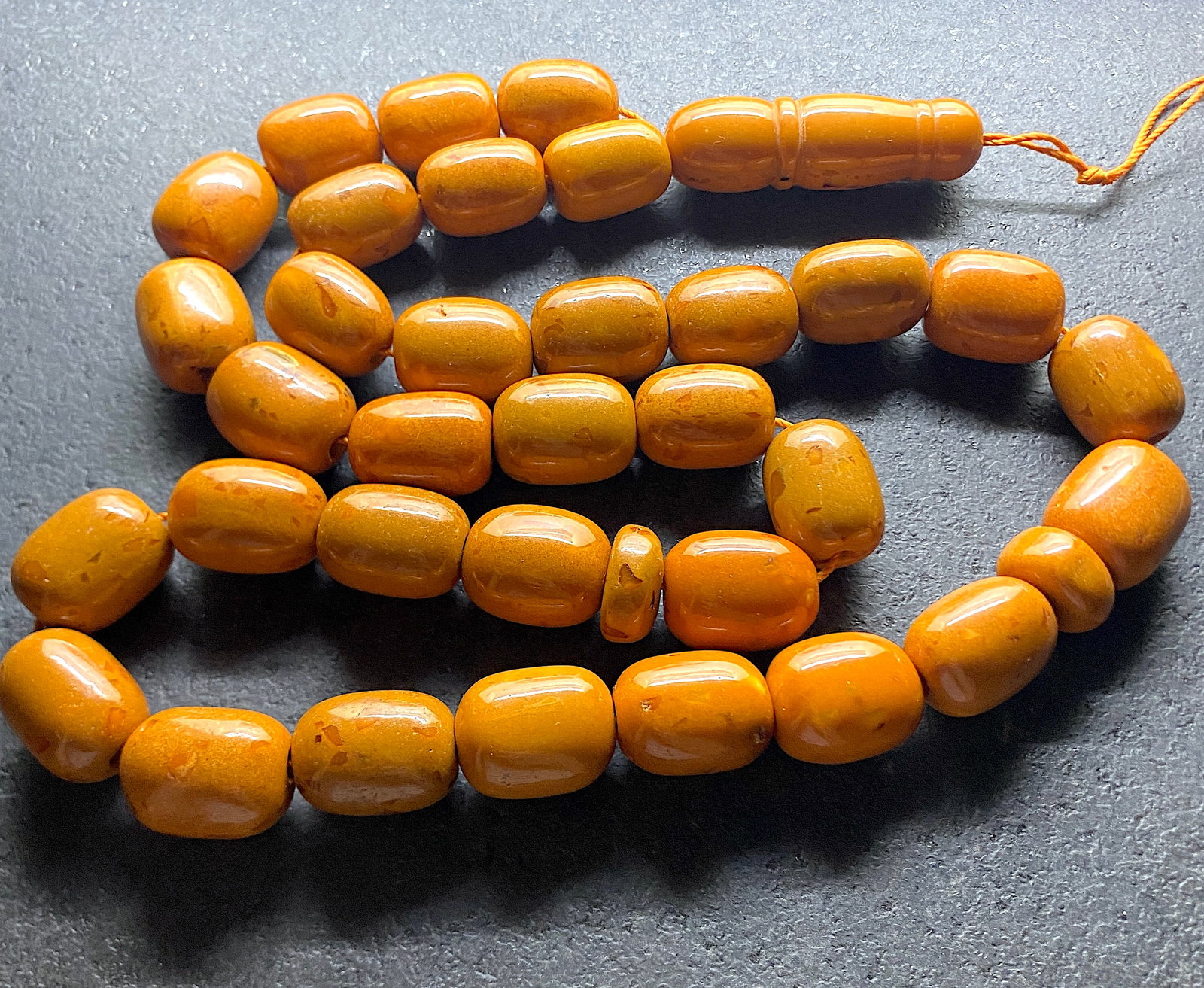 Phenomenal Amber Tesbih made from Barrel shaped Amber beads: Title:Phenomenal Amber Tesbih made from Barrel shaped Amber beads Metal:None Gemstone:Amber Weight:144.0 g Size:Bead size: 22.0 x 16.0 mm Bead size: 0.866 x 0.63 inches Made of:(Reconstituted Amber or