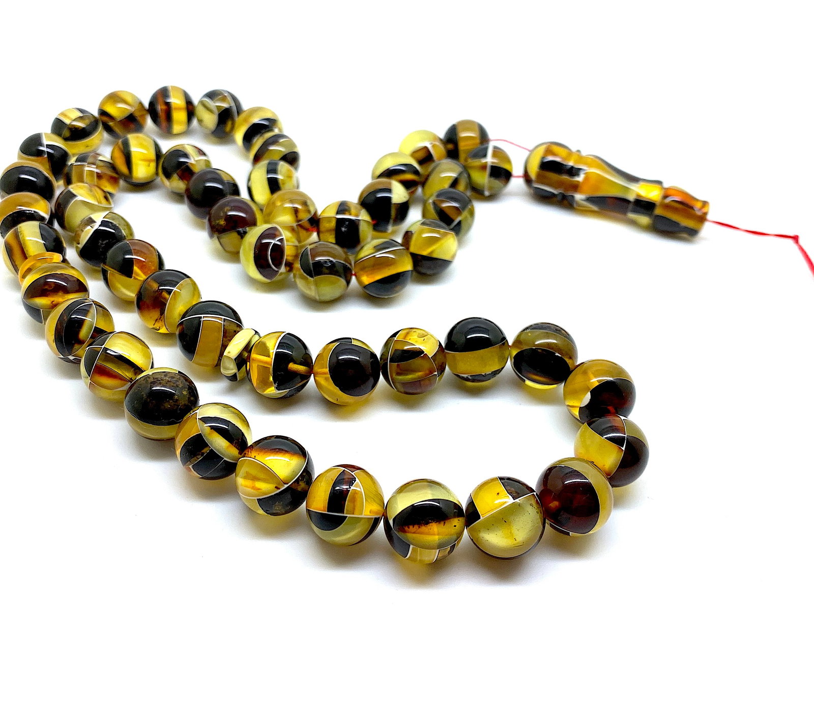 Unique and Staggering Amber Tesbih made from Round Amber beads: Title:Unique and Staggering Amber Tesbih made from Round Amber beads Metal:None Gemstone:Amber Weight:58.5 g Size:Bead size: 12.0 mm Bead size: 0.472 inches Made of:(Reconstituted Amber or Whole