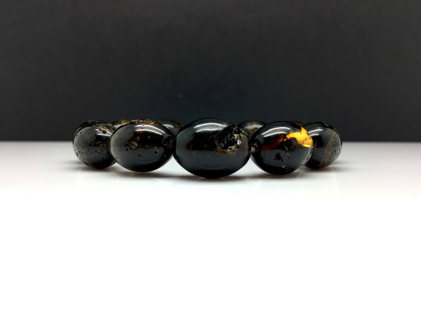 Antique Amber Bracelet made from Olive shaped Amber beads: Title:Antique Amber Bracelet made from Olive shaped Amber beads Metal:None Gemstone:Amber Weight:19.5 g Size:Bead size: 12.91 x 18.34 mm Bead size: 0.508 x 0.722 inches Made of:(Reconstituted Amber