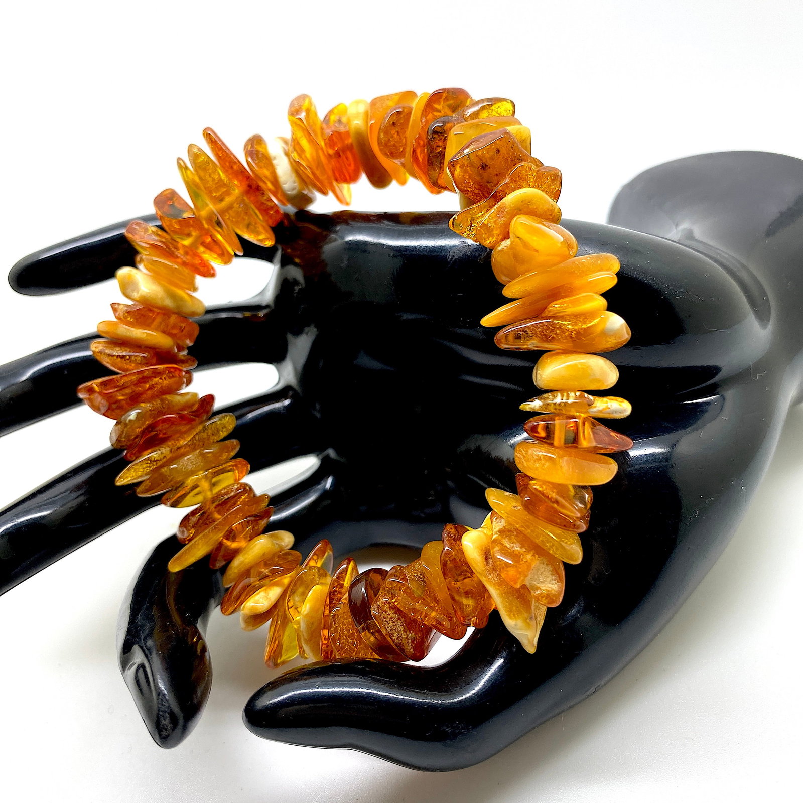 Exquisite Amber Bracelet made from Rough in shape Amber beads: Title:Exquisite Amber Bracelet made from Rough in shape Amber beads Metal:None Gemstone:Amber Weight:26.5 g Size:Bead size: 15.0 x 15.0 mm Bead size: 0.591 x 0.591 inches Made of:(Reconstituted Amber 