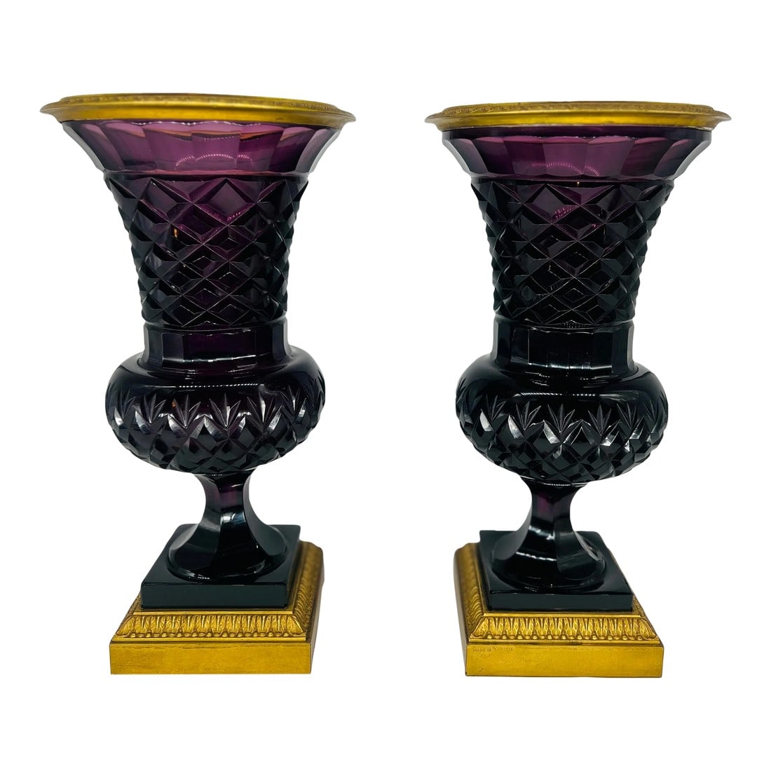 Pair, 19th Century Austrian Ormolu Mounted Amethyst Urns: An incredibly fine pair of antique Amethyst cut crystal vases mounted with dore bronze mounts. The vases have delicate faceted detail reminiscent of the Baccarat firm in France which likely supplied t