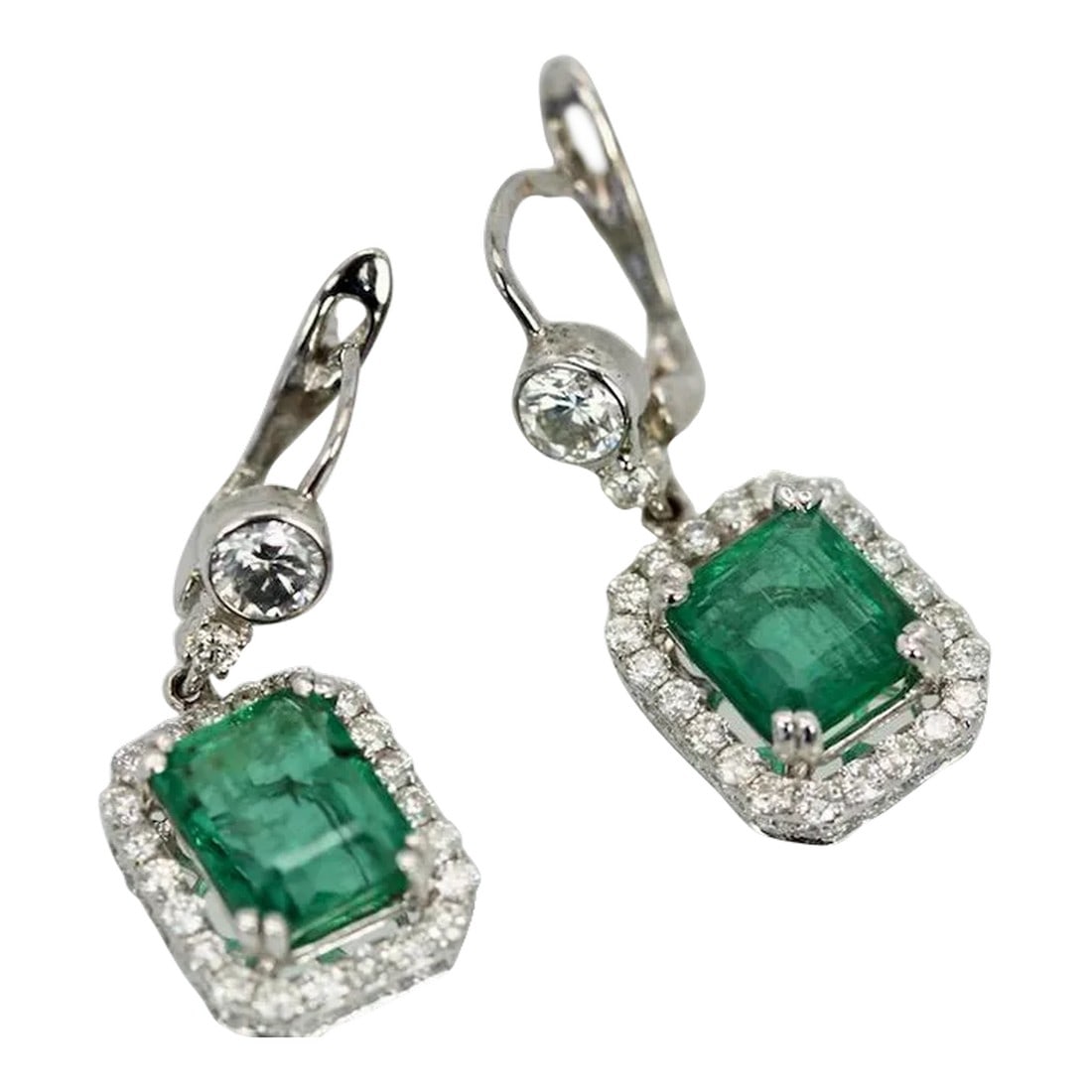 Emerald Diamond 18k Earrings - 2 Pieces: This is part of Chairish's Fine Jewelry assortment. Emerald Diamond 18K Earrings These Emerald earrings are a match to the Emerald ring listed and are a gorgeous shade of green transparent and lively.