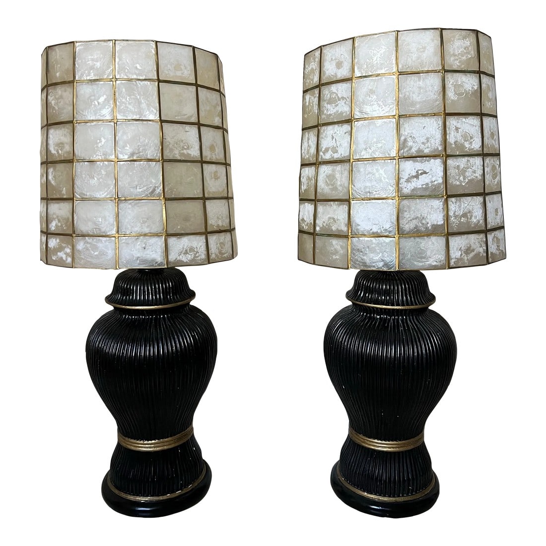 Vintage Lamps With Capiez Shell Shade - Pair: Pair of 1950s Hollywood Regency Black and gold lamps with Capiz shell shades. The Pair of shades are metal framed with Capiz shell. The base is the shape of ginger jar. Lamp measures 19" to socket-