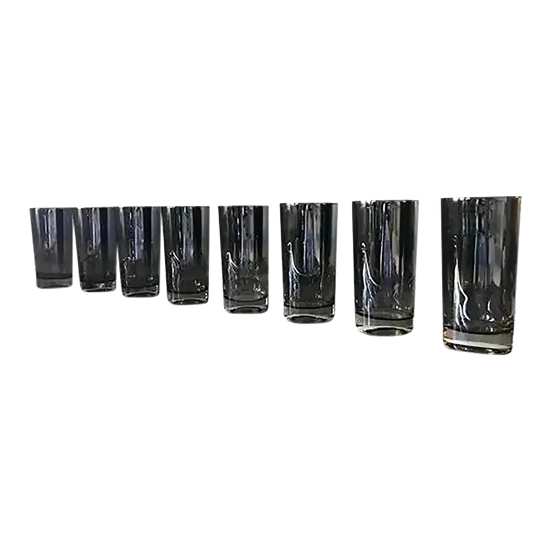 1960s Mid-Century Modern Chrome Modernist Cocktail Glasses Attributed to Dorothy Thorpe- Set of 8: This set of 1960s cocktail glasses reflects the clean lines and modernist design attributed to Dorothy Thorpe. The chrome finish adds a striking detail, making them a practical yet stylish choice for 