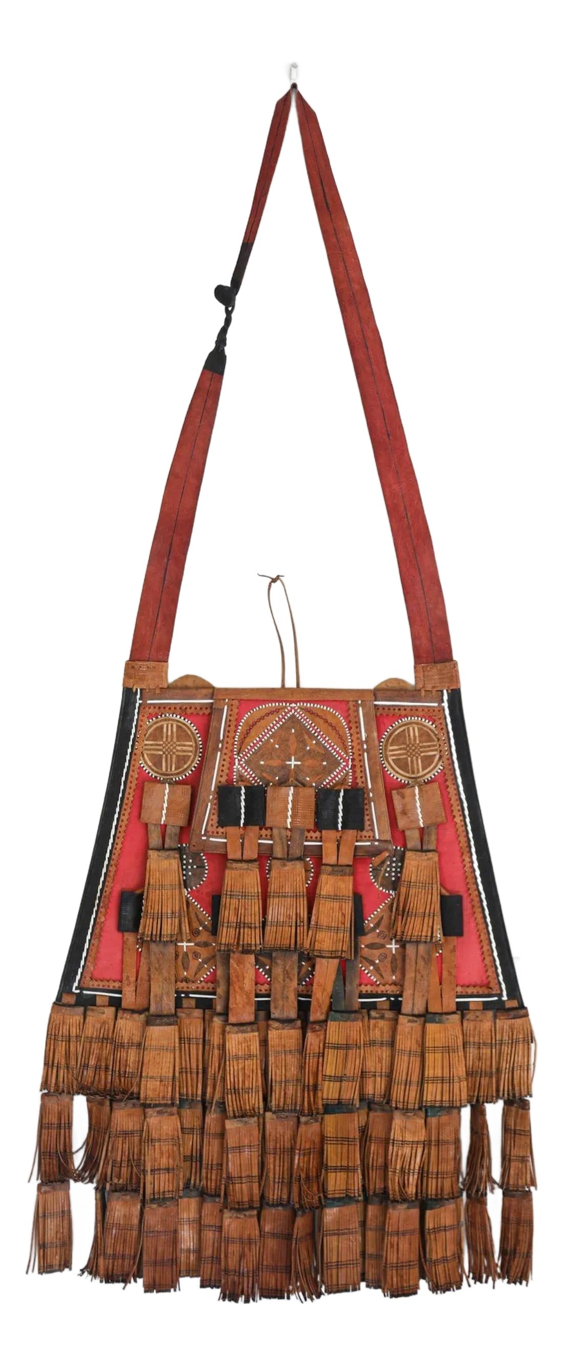 Antique African Tuareg Red Black and Brown Leather Bag: Vintage African Tuareg red, black and brown leather bag with fringes. A great old fringed leather bag from the Tuareg sourced in Mali. Handcrafted by the Tuareg women in Mali Africa who are in charge