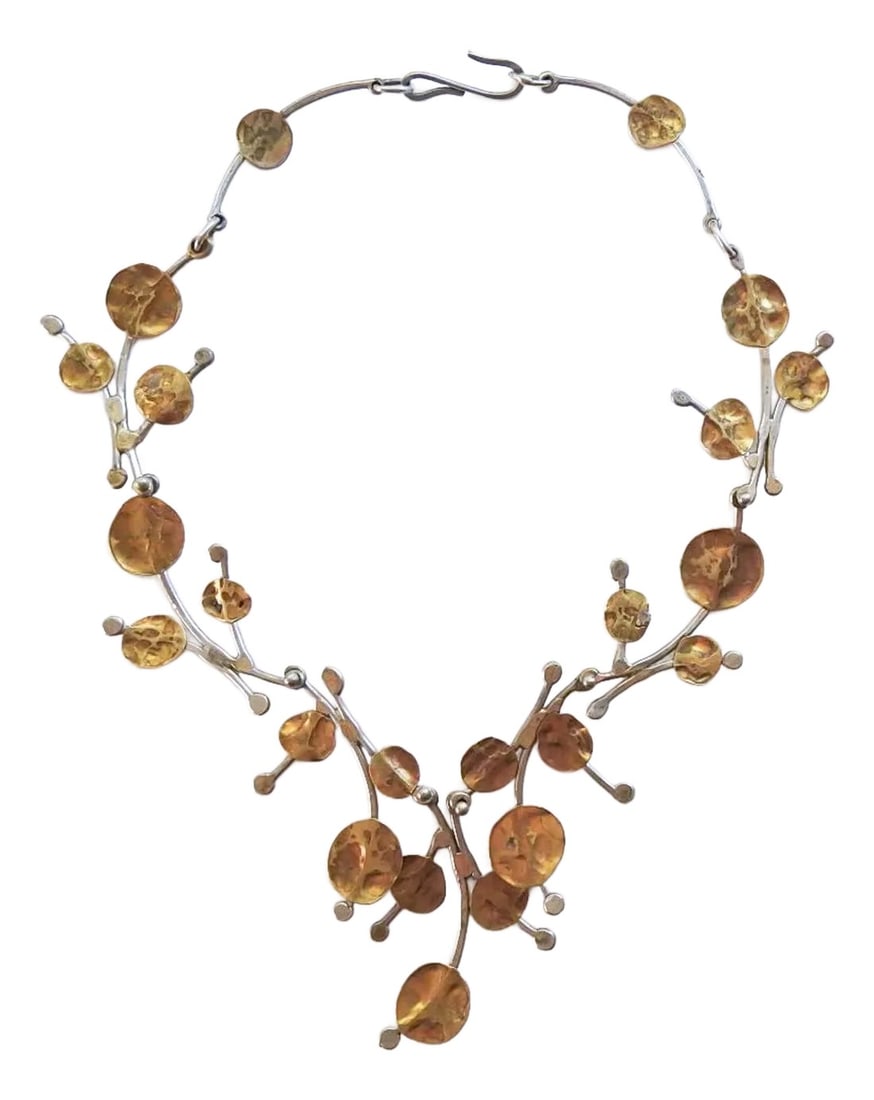 Late 20th Century Artist Made Free Form Foliate Necklace: Late 20th century brass and white metal artist handmade free form necklace. Brass foliate accents on white metal (possibly nickel) freeform links, each link about 2.25" long, center drop element 2.5"