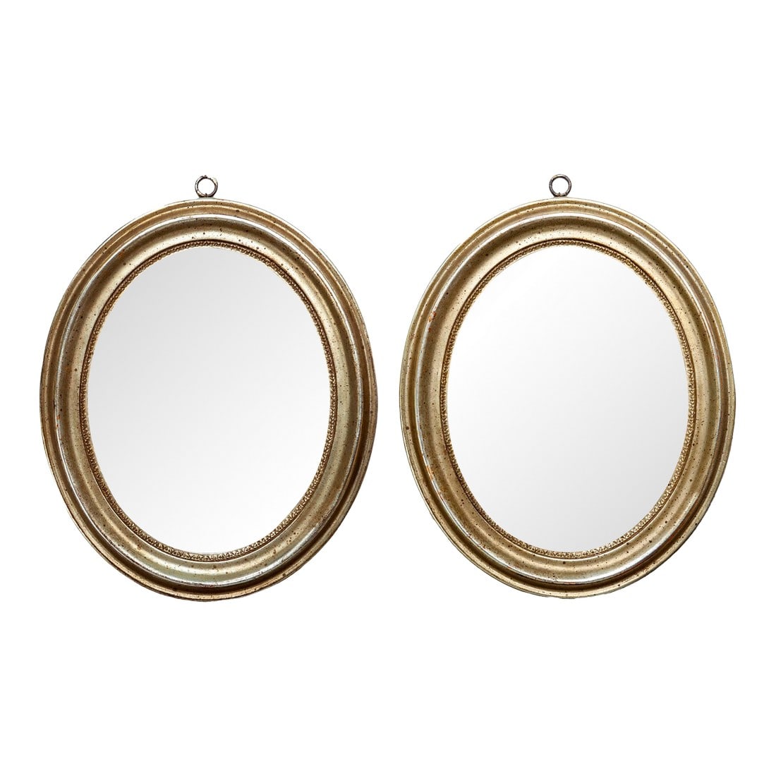 Pair of Oval 1950s Italian Borghese Gilt Wood Mirrors: A Charming Pair of Oval 1950s Italian Borghese Baroque Gilt Wood Mirrors. There are some age spots on the Mirror which adds to it's charm and age. There is an attached metal hoop on each for hanging.