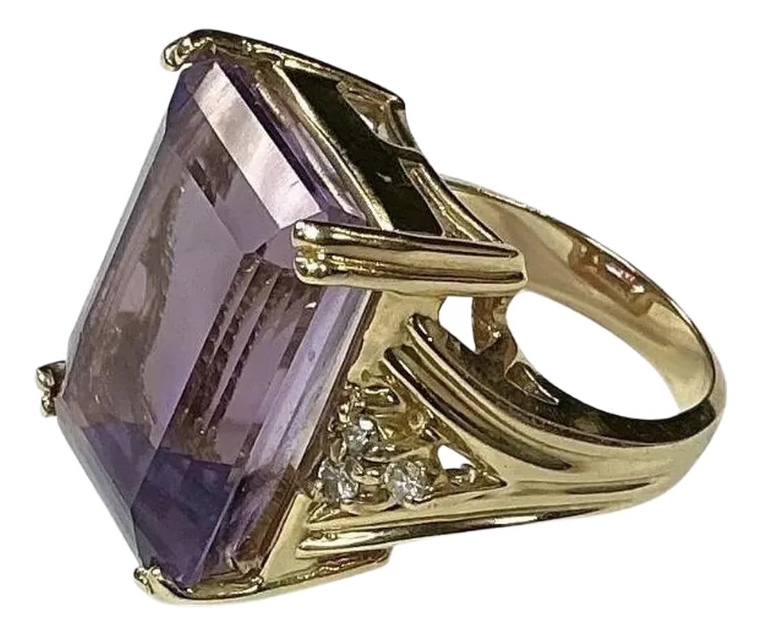 14k Yellow Gold Amethyst and Diamond Ring: 14k Yellow Gold Amethyst and Diamond Ring. 9.8 dwts. The dimensions of the amethyst baguette are approximately 19 mm length x 14 mm width x 6 mm depth. The ring has six round single cut diamonds.