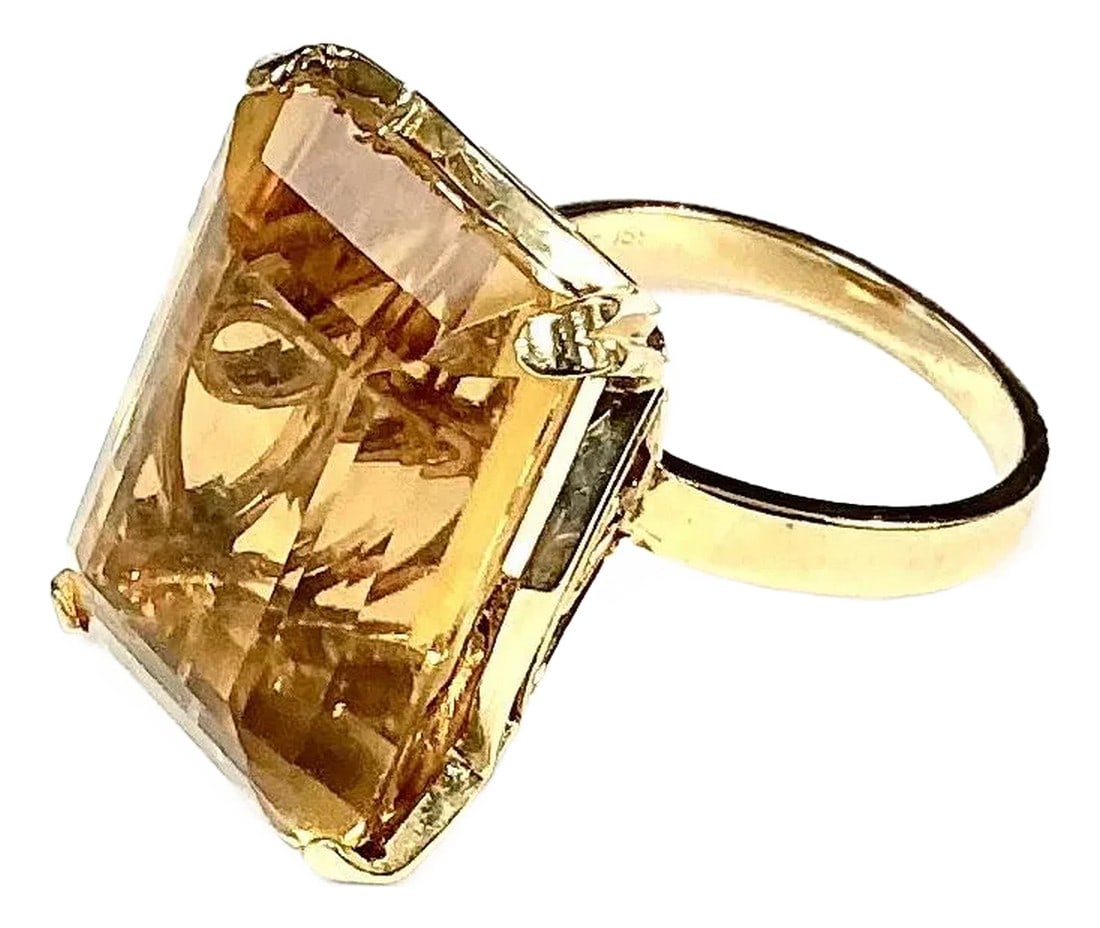 14k Yellow Gold Ring 15 Carat Emerald Cut Citrine: 14k yellow gold emerald cut Citrine ring, 9.79 Grams TW. The dimensions of the emerald cut citrine are approximately 15 mm x 20 mm. Approximately 15 carats. Marked 14k. Approximate size 6.0. Condition