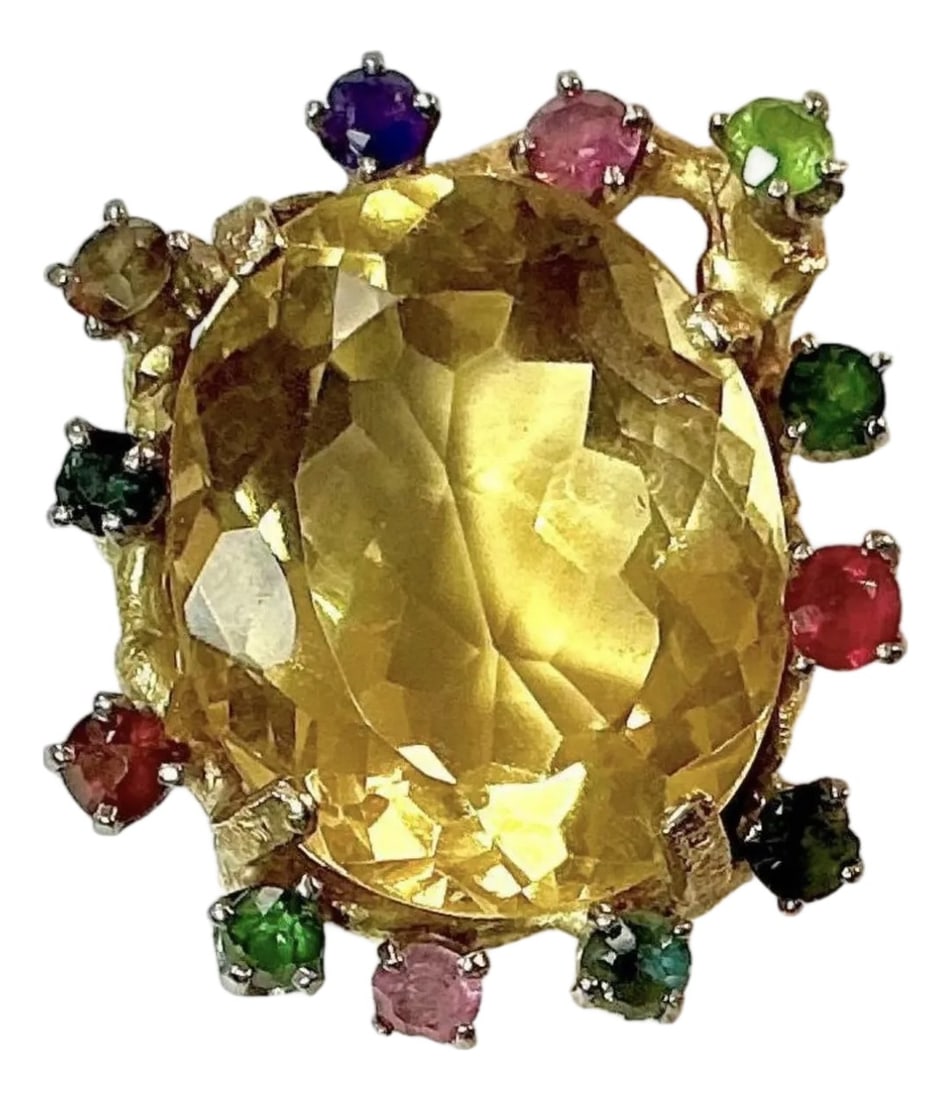 Large Citrine With Multiple Gemstones Ring 18k Yellow Gold: 18k yellow gold Citrine and diamond ring, The dimensions of the oval Citrine are approximately 30 mm x 15 mm. Approximately 12 carats. 18K tested. Approximate size 6.5. Condition: Alterations: