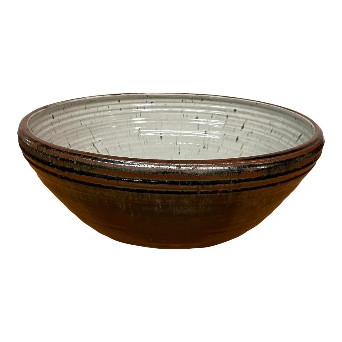 Oversized Studio Pottery Bowl With Earth-Toned Glaze - Mid Century: A dramatic large-scale studio pottery bowl, wheel-thrown in stoneware and richly glazed in earth tones, dating to the 1960s–1970s. The exterior features a dark, tenmoku-inspired glaze with