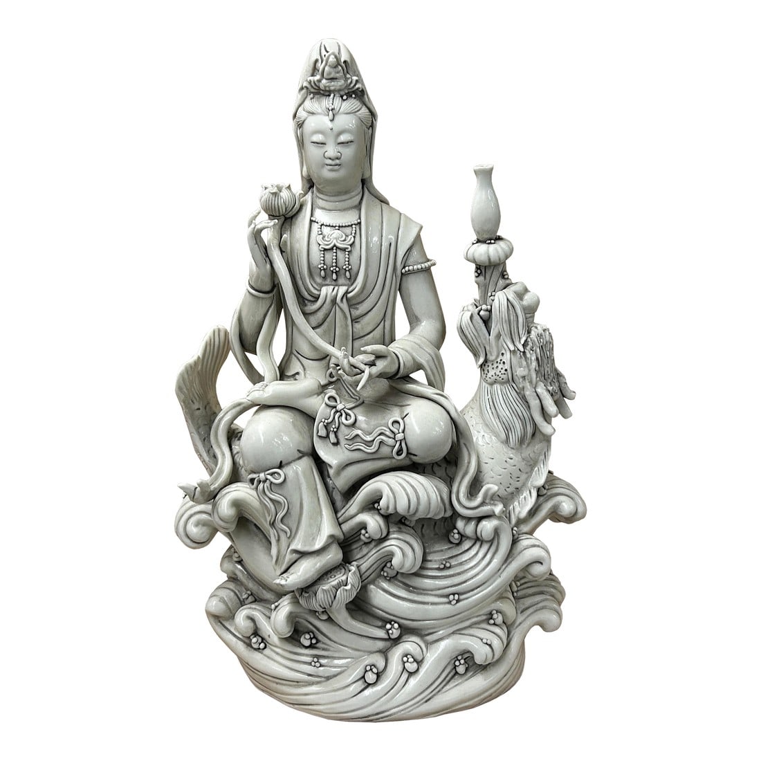 Chinese Handcrafted GuanYin Bodhisattva on Dragon White Porcelain Statue: Discover the serene elegance of this exquisite handcrafted porcelain statue, a masterful representation of Guanyin, the Buddhist Goddess of Mercy, seated gracefully atop a lotus pedestal surrounded