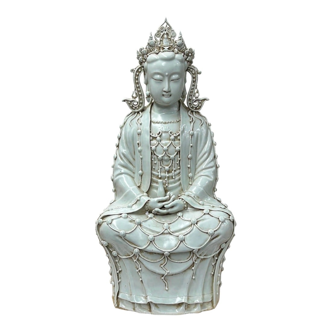 Pale Celadon White GuanYin Bodhisattva Tong Style Porcelain Statue: Capture the essence of tranquility and timeless elegance with this magnificent ceramic sculpture of a Bodhisattva, likely Guanyin, the Goddess of Mercy. Rendered in a stunning celadon glaze, the