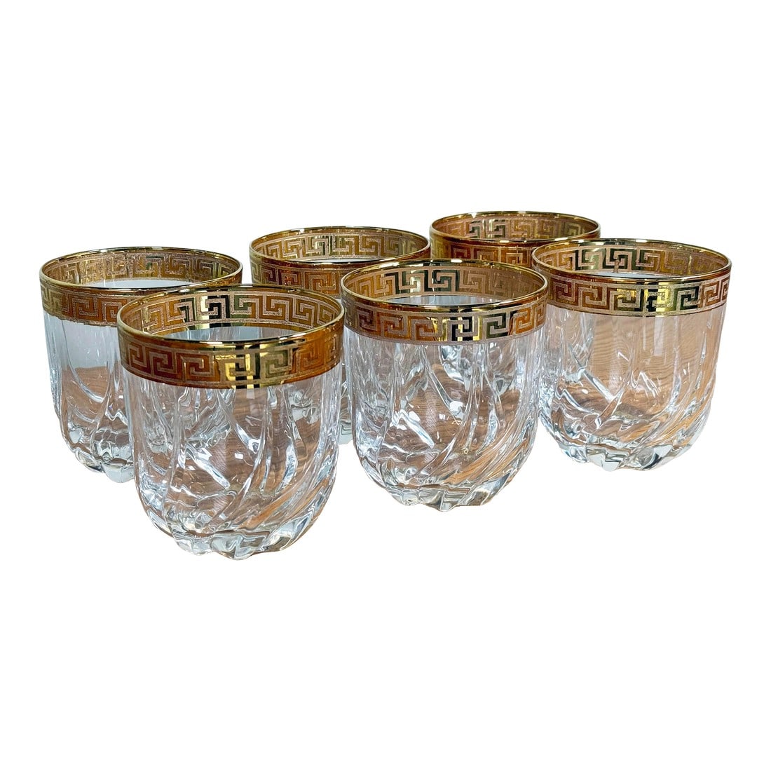 Vintage Gold Greek Key Rimmed Crystal Old Fashioned Glasses - Set of 6: Set of six vintage crystal Old Fashioned / Lowball glasses featuring a bold 24k-tone Greek-key gold band at the rim. Each glass is deeply cut with a swirling vertical pattern and a polished base.
